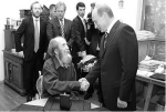 I found the answer here in a photo of Alexander Solzhenitsyn and Vladimir Putin.jpeg